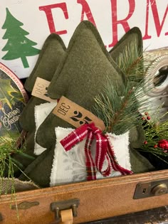 an old suitcase filled with christmas decorations