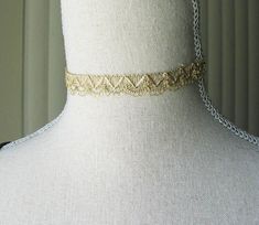 "This gorgeous golden choker is reminiscent of the beautiful 18th and 19th century designs. The choker is 12 1/4\" long with a 2\" extender chain that has a golden glass bead. Has a lobster clasp. It's the perfect fashion accessory, modern or historical. Comes in a lovely gift box with ribbon. Bridgerton inspired. In the Eighteenth and Nineteenth centuries, chokers were very fashionable. Some were made of pearls, lace or ribbon and can be seen in many classic portraits. I think they're a very elegant accessory even today." Adjustable Gold Chain Necklace For Formal Occasions, Silver Choker With Gold Chain For Gift, Adjustable Gold Choker Necklace, Gold Vintage Choker With Clavicle Chain, Adjustable Vintage Choker Chain Necklace, Vintage Gold Choker For Formal Occasions, Victorian Gold Choker Necklace, Adjustable Gold-tone Choker For Gift, Adjustable Metal Gold Chain Choker