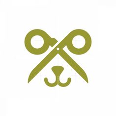 scissors and a dog's head are depicted in this logo