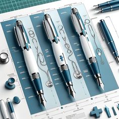 four different types of fountain pens sitting on top of a blueprint