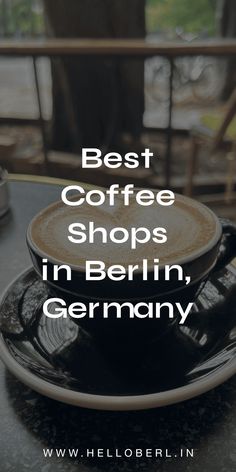 a cup of coffee sitting on top of a saucer with the words best coffee shops in berlin, germany