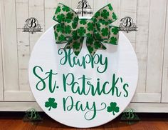 a st patrick's day sign with green bows