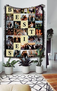 a wall hanging on the side of a living room with pictures and words in it