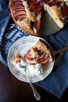 a piece of pie on a plate with whipped cream