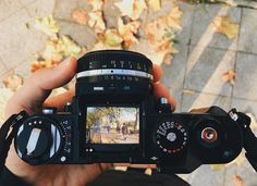 a person holding a camera in their hand