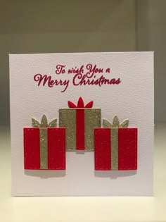 a christmas card with three presents on it