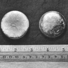 three small objects are shown next to a ruler