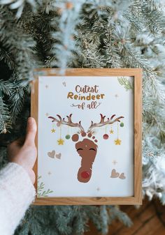 someone holding up a christmas card with a reindeer's face and the words, cute reindeer of all