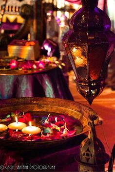 an assortment of colorful lights and decorations on display in a fancy room with purple lighting