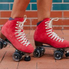 the legs and feet of a person wearing roller skates