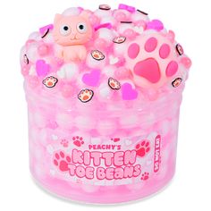 a pink tub filled with lots of bubbles and a cat toy in the middle of it