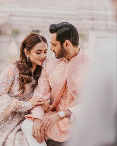 a man and woman sitting next to each other