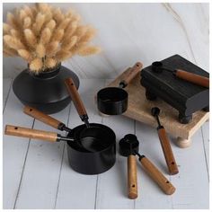 an assortment of cooking utensils on a table