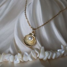 Clam Necklace, Pearl and Shell Necklace, Mermaid Jewelry for Her, Mermaidcore Jewelry, Shell Jewelry, Gift for Her, Ocean Jewelry ☽ 16K Gold Plated, Acrylic Pearl (12x15mm) ☽ This is a gold plated charm meaning that it requires extra care to keep its shine and color intact. Please follow these tips to make the charm last longer in its original condition: avoid wearing it to the beach, pool, shower, bathtub, hot tub; avoid it touching any lotions, creams, or sweat; take it off before going to bed Pearl In Shell Necklace, Pearl Clam Necklace, Mermaid Jewelry Necklaces, Clam Shell Necklace, Clam Necklace, Jewelry Ocean, Gold Ocean Jewelry, Mermaid Jewelry Aesthetic, Mermaid Jewlery