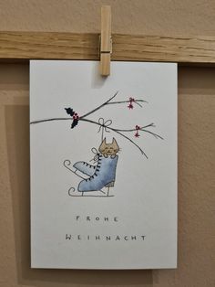 a greeting card with a cat on a skateboard hanging from a clothes line and the words, frohe hehnach