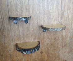 three pieces of wood with metal brackets on them