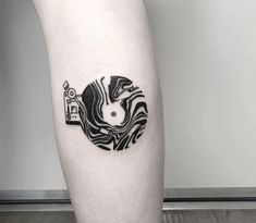 a person with a tattoo on their leg