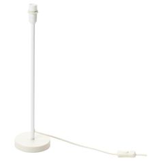 a white lamp with a cord attached to it