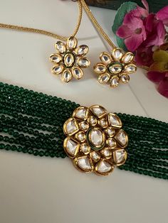 Discover the epitome of elegance with our premium necklace set. Crafted with precision and designed to turn heads, this set is a true masterpiece. Product Details: Material: Each piece is meticulously handcrafted from high-quality brass, Copper, Silver, Kundan Work, Green Beads, Premium Dori. Choker Necklace Dimensions: Weight: 55 grams. Closure Type: Premium Dori Adjustable Size: Yes Width of Choker: 4 cm.  Stud Earring Dimensions (Per Pair): Weight: 16 grams Diameter: 2.8 cm Closure Type: Push Back Closure Exquisite Design: This set boasts a design that's truly captivating, ensuring you stand out on any occasion. Compliment Magnet: Expect a shower of compliments every time you wear this stunning ensemble. Indulge in the finest craftsmanship with our necklace set. Elevate your style, make Elegant Kundan Formal Sets, Elegant Kundan Sets For Formal Occasions, Elegant Kundan Sets For Ceremonial Occasions, Elegant Brass Kundan Necklace For Celebration, Elegant Kundan Choker For Formal Occasions, Elegant Kundan Necklace For Celebration, Elegant Hand Set Choker For Ceremonial Use, Elegant Hand Set Choker For Ceremonial Occasions, Elegant Formal Kundan Choker