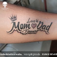 a man with a tattoo on his arm that says love you mom dad forevers