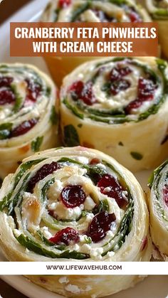 cranberry feta pinwheels with cream cheese are on a white plate