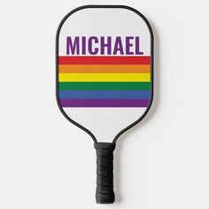 a racket with the name michael on it and a rainbow stripe in the middle