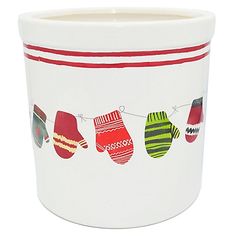 a white cup with christmas stockings on it