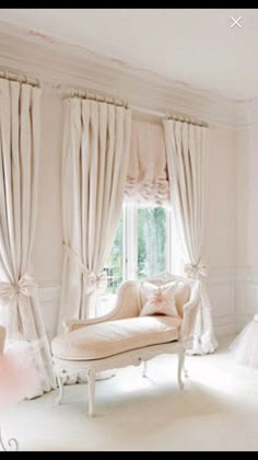 a room with white furniture and curtains on the windowsills is decorated in pink