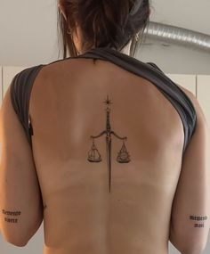 Spine Dagger Tattoo, Back Tattoo Women Symmetrical, Siren Back Tattoo, Dagger Arm Tattoo, Knife Spine Tattoo, Tattoos That Represent Independence, Dagger Back Tattoo, Dagger Spine Tattoo, Cute Spine Tattoos