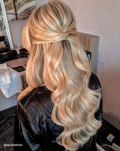 a woman with long blonde hair in a salon