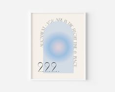 a white framed poster with the words 22 22 and an image of a blue circle