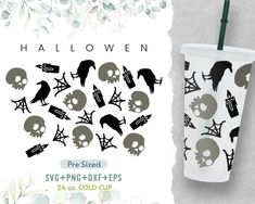 the halloween cup has skulls and bats on it, as well as a green straw