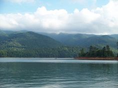 a body of water with mountains in the background