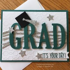 a graduation card with the word grad it's your day written on it