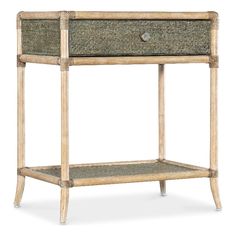 Hooker Furniture - End Tables - 69509011735 - Inspired by tropical getaways, the two-tone Retreat Pole Rattan Bedside Table is a mixture of natural materials in a laid-back, versatile design. Crafted of Maple Veneers, Raffia and Rope, it features painted Raffia on the top and shelf in a Seagrass accent green, while the frame and legs are in the sand-colored Dune finish. Featuring one self-closing drawer and one fixed shelf, the table has a glass top insert.Maple Wood Veneers, Engineered Raffia, Rope and Tempered Glass; Dune beige: Transparent by design to showcase the unique grain patterns of the veneer, Dune beige is light as sand and smooth as a shore after a receding tide. Seagrass accent green finish.; One self-closing drawer; One fixed shelf; Levelers; Painted raffia shelf and top; Gl Rattan Bedside Table, Tropical Getaways, Hooker Furniture, Maple Wood, Wood Veneer, Accent Table, End Table, Bedside Table, Table Furniture