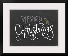 a chalkboard with the words merry christmas written in white and green lettering on it