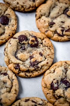 chocolate chip cookies on a baking sheet ready to be eaten