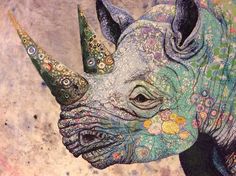 a painting of a rhinoceros with flowers on it's head