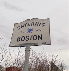 a white street sign sitting on the side of a road