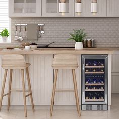 two wooden stools sit in front of a wine cooler that is built into the wall