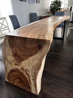 a large wooden table with chairs around it