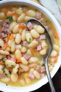 a white bowl filled with ham and bean soup