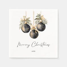 a christmas card with three ornaments hanging from it