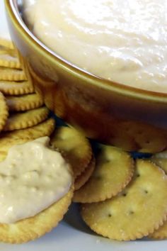 crackers and dip in a bowl on a plate