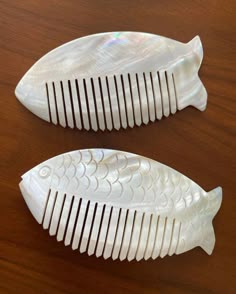 Antique from 1950s, handcrafted, %100 mother of pearl, fish shaped hair combs / brushes / ornaments; sold as pair. *Excellent vintage condition  *Made in Greece *This naturally beautiful, anti-static hair combs hand carved from mother of pearl *Exclusive natural crystal for oldest beauty & self care routine & hair growth *Hancrafted and shaped as a fish so every individual piece  is one of a kind *They have smooth surface, semi-transparent to light & natural  stone color *Perfect as unique gift for bridal or baby shower, weeding, Valentine's Day Mother's Day or any other special occasion *No chips, cracks or scratches *They measure; 11 cm / 12 cm Notes: Sold in pair. Your item(s) will be wrapped with care to ensure safe arrival. Feel free to contact me with any questions. International shi Mermaidcore Hair Accessories, Beauty Self Care, Antique Hairbrush, Natural White Hair, Mother Of Pearl Hair Comb, Vintage Hair Comb, Static Hair, Pearl Comb, Vintage Comb