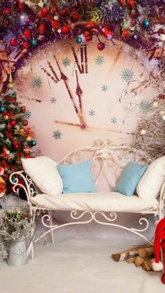 a white bench sitting in front of a wall with christmas decorations on it's sides