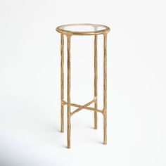 a gold metal and glass side table