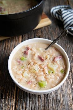 a bowl of soup on a wooden table