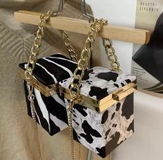 This one of a kind handbag brings additional fierceness & timeless style! We guarantee you’ll fall in love. Animal print is a forever vibe so, be prepared for endless compliments. “ℂ𝕒𝕣𝕣𝕪 𝔸 𝕊𝕥𝕒𝕥𝕖𝕞𝕖𝕟𝕥 ℕ𝕠𝕥 𝕁𝕦𝕤𝕥 𝔸 𝔹𝕒𝕘” Details & Care -Box shaped handbag -Available Prints: Zebra & Cow (black and white) -Pu Leather -Lining: Polyester -Lock latch closure Measurements Size: H 4”x W 5.75” x L 4” Handle Height: 3.9in/ 9.9cm Shoulder Strap Length: 47.2in/ 119.88cm Leopard Print Handbags, Mini Chain Bag, Pu Bag, Mini Box, Womens Designer Handbags, Wedding Clutch, Animal Prints Pattern, Trendy Handbags, Handbags Casual