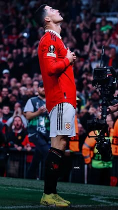 a man standing on top of a soccer field